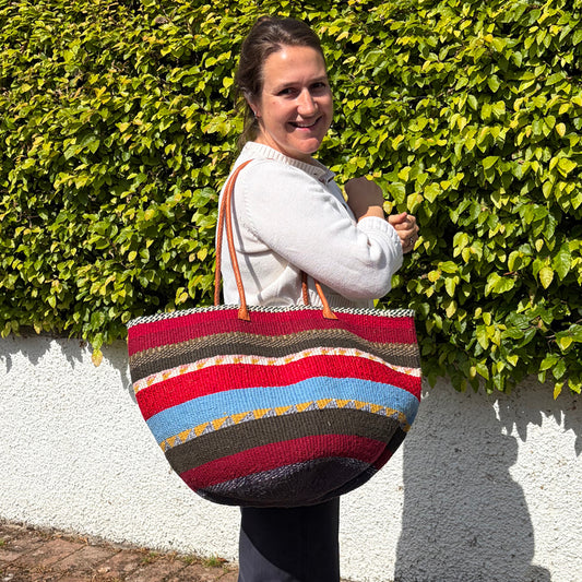 Woollen Kiondo Basket Burgundy, Reds Greys, charcoal & Mustard Hoops with long Leather handles.