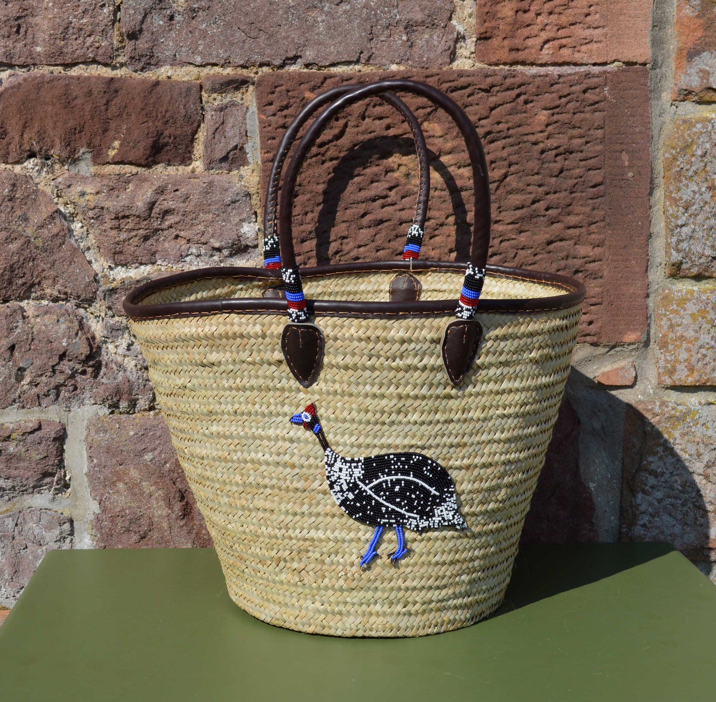 Beaded Tanzanian Seagrass Baskets with hand stitched Leather & Beaded Motifs