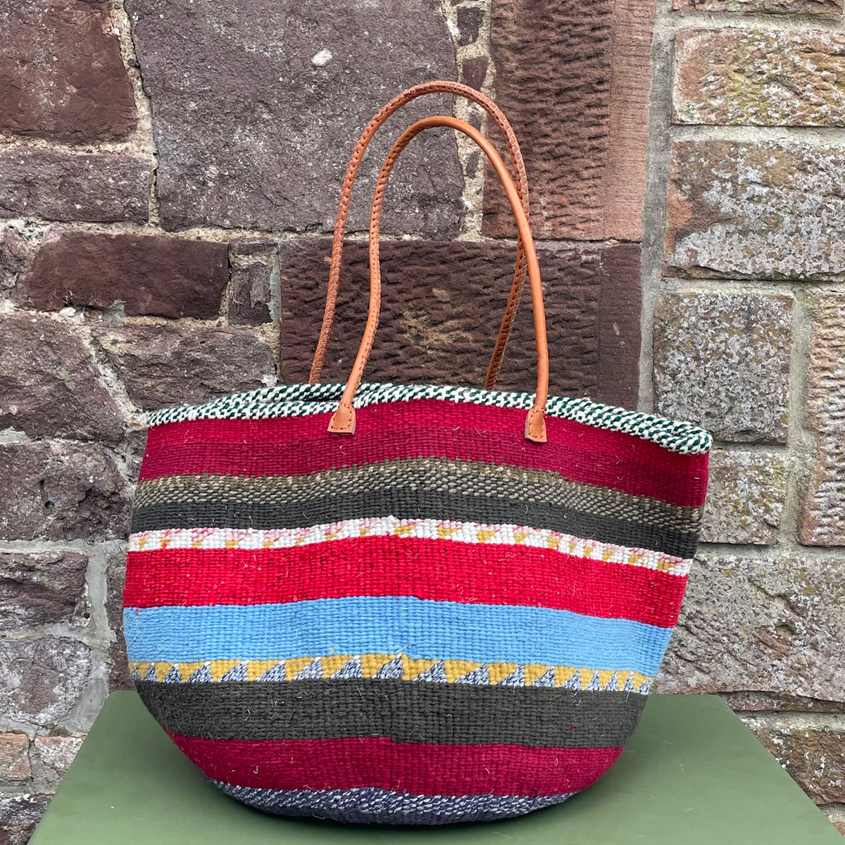 Woollen Kiondo Basket Burgundy, Reds Greys, charcoal & Mustard Hoops with long Leather handles.